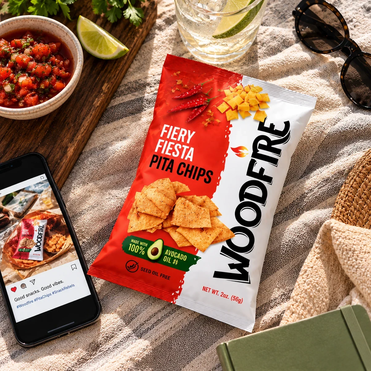 Woodfire Fiery Fiesta pita chips on a table with dips and lime