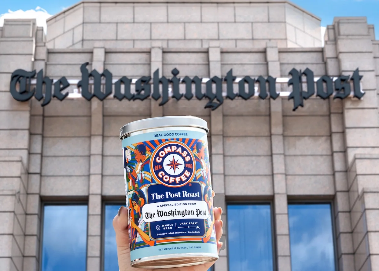Compass Coffee’s Post Roast tin held outside The Washington Post building